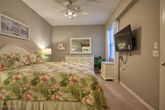 carpeted bedroom with baseboards and ceiling fan