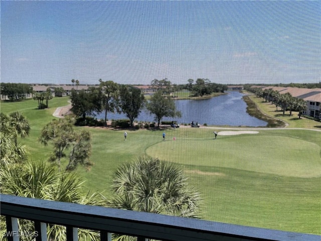 view of home's community with a water view and golf course view