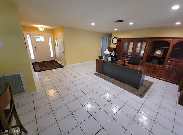 living room with light tile patterned floors, recessed lighting, and visible vents