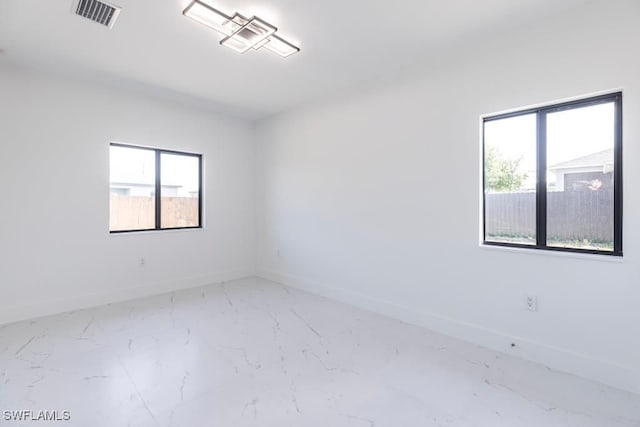 1111 SW Embers Ter, Cape Coral, FL 33991 - empty room featuring baseboards and marble finish flooring