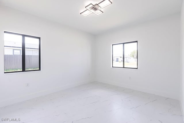 1111 SW Embers Ter, Cape Coral, FL 33991 - unfurnished room with healthy amount of natural light and baseboards