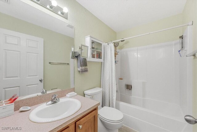 3210 31st St W, Lehigh Acres, FL 33971 - bathroom with vanity, shower / bath combo, and toilet
