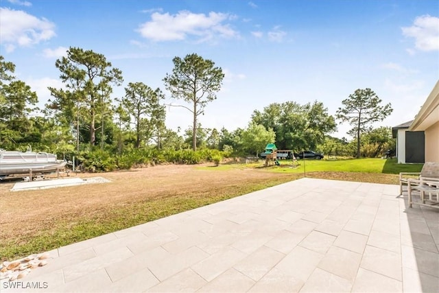 3210 31st St W, Lehigh Acres, FL 33971 - view of patio / terrace featuring a playground