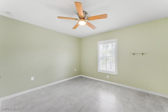 3210 31st St W, Lehigh Acres, FL 33971 - unfurnished room with baseboards and ceiling fan