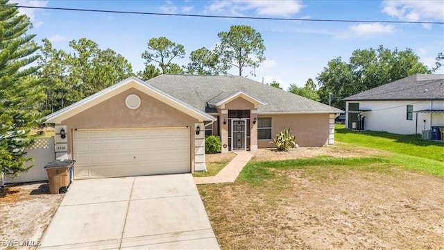 3210 31st St W, Lehigh Acres, FL 33971 - single story home with an attached garage, stucco siding, a front yard, and concrete driveway