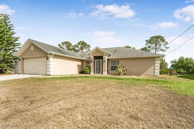 3210 31st St W, Lehigh Acres, FL 33971 - ranch-style home featuring a garage, stucco siding, concrete driveway, and a front lawn
