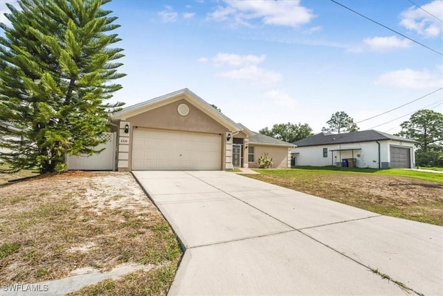 3210 31st St W, Lehigh Acres, FL 33971 - single story home with a garage, stucco siding, driveway, and a front lawn