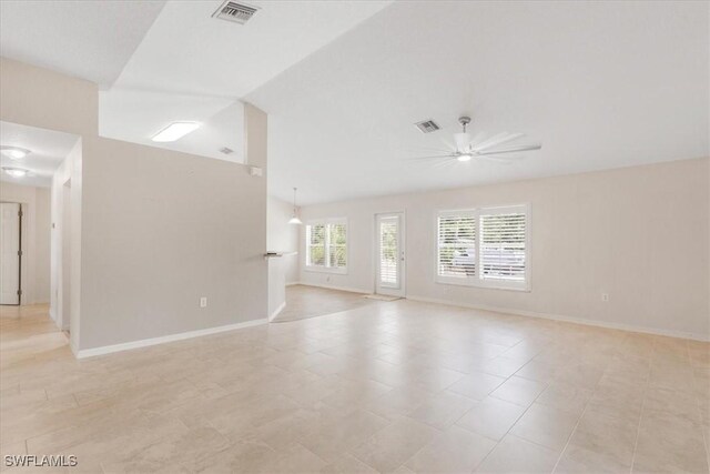 3210 31st St W, Lehigh Acres, FL 33971 - spare room with vaulted ceiling, baseboards, a ceiling fan, and visible vents