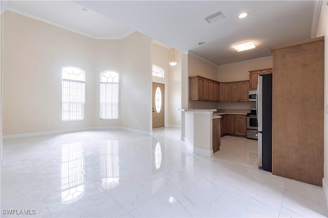 kitchen with stainless steel appliances, light countertops, marble finish floor, open floor plan, and crown molding