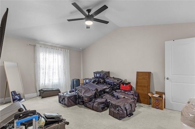 carpeted bedroom featuring ceiling fan and vaulted ceiling
