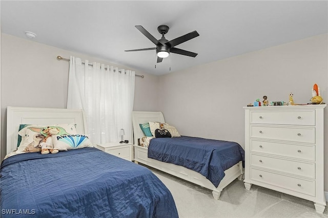 bedroom featuring ceiling fan and light carpet