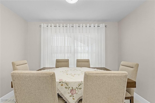 dining room with baseboards