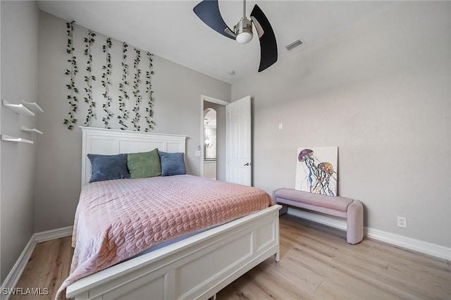 bedroom with visible vents, ceiling fan, baseboards, and light wood-style floors