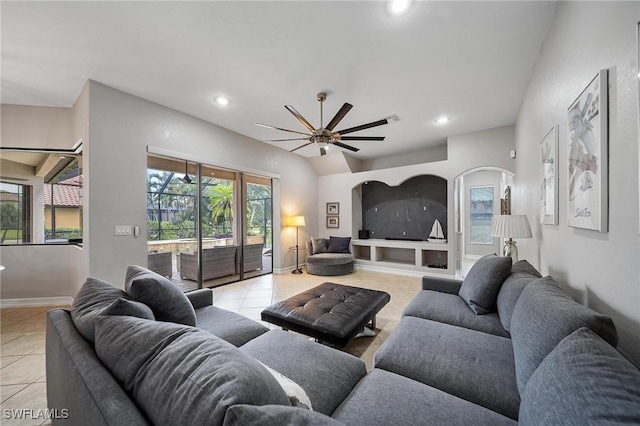 living area featuring baseboards, recessed lighting, light tile patterned floors, and a ceiling fan