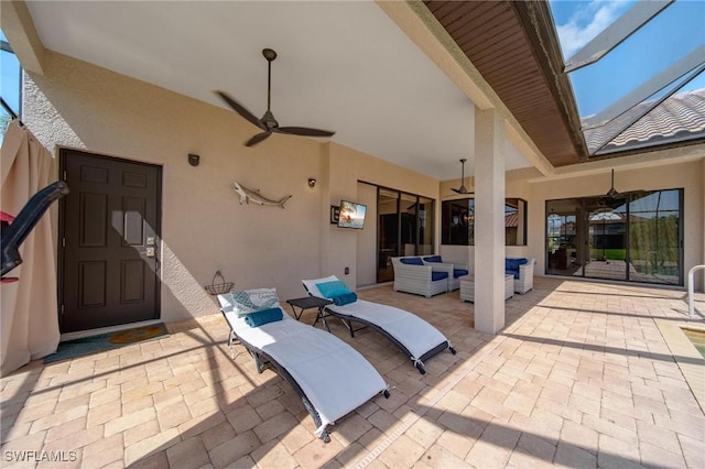 view of patio / terrace featuring an outdoor living space and ceiling fan