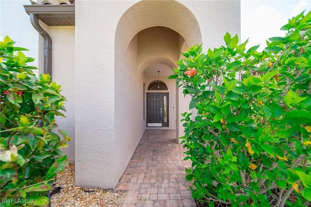 doorway to property with stucco siding