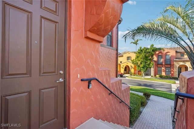 property entrance featuring stucco siding