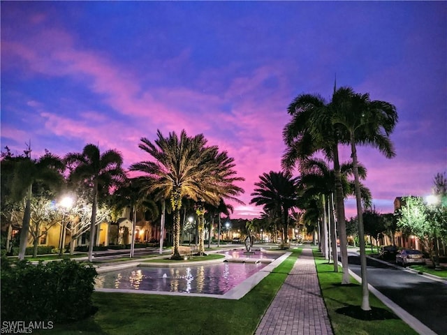 view of property's community with a lawn