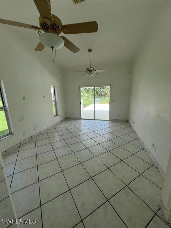 2875 18th Ave SE, Naples, FL 34117 - spare room with light tile patterned flooring, ceiling fan, visible vents, and plenty of natural light