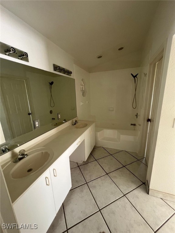2875 18th Ave SE, Naples, FL 34117 - bathroom with double vanity, a sink, shower / bath combination, and tile patterned floors