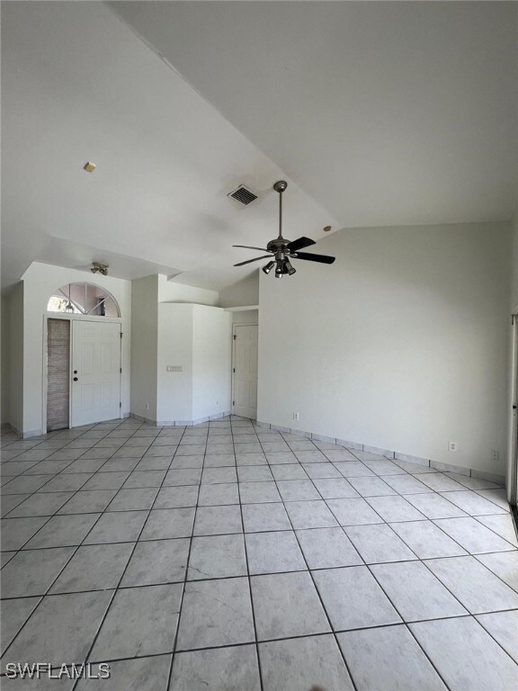2875 18th Ave SE, Naples, FL 34117 - interior space featuring light tile patterned floors, visible vents, a ceiling fan, and lofted ceiling