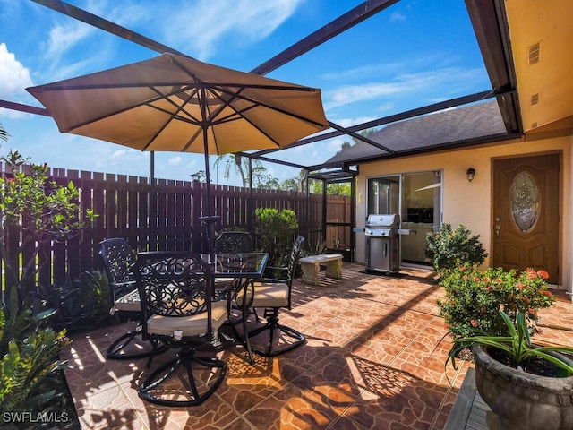 view of patio / terrace with fence, visible vents, grilling area, and outdoor dining area