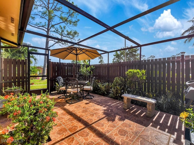 view of patio / terrace with fence, outdoor dining space, and visible vents