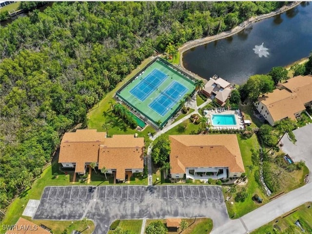 birds eye view of property featuring a water view