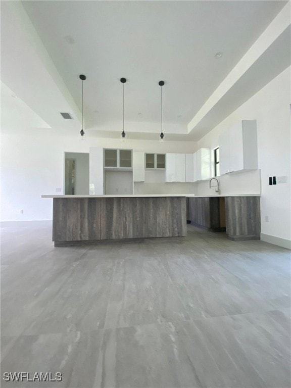 1918 Blue Sage Dr, Naples, FL 34117 - kitchen featuring modern cabinets, white cabinets, pendant lighting, and light countertops