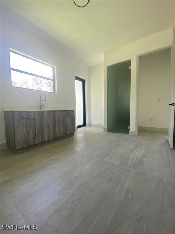 1918 Blue Sage Dr, Naples, FL 34117 - unfurnished room with a sink and baseboards