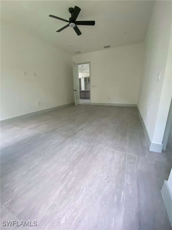 unfurnished bedroom with a ceiling fan, visible vents, and baseboards