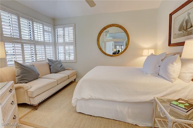 bedroom with a ceiling fan and wood finished floors