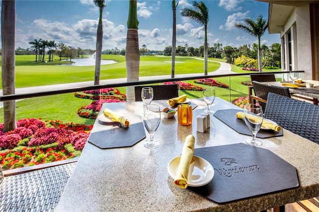 exterior space featuring a water view and view of golf course