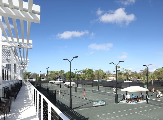 view of sport court with fence