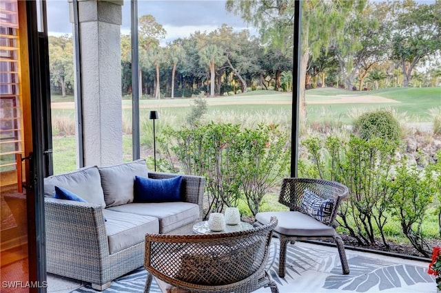 sunroom / solarium with golf course view