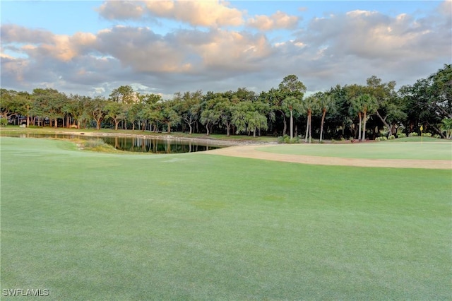 view of community featuring a water view and golf course view