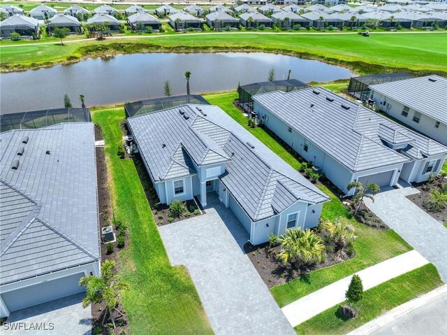 aerial view featuring a residential view and a water view