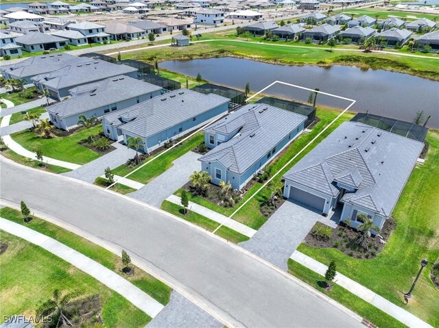 bird's eye view with a water view and a residential view