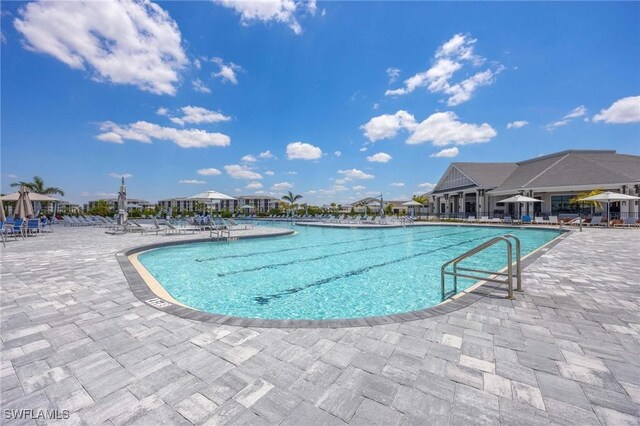 community pool with a patio area
