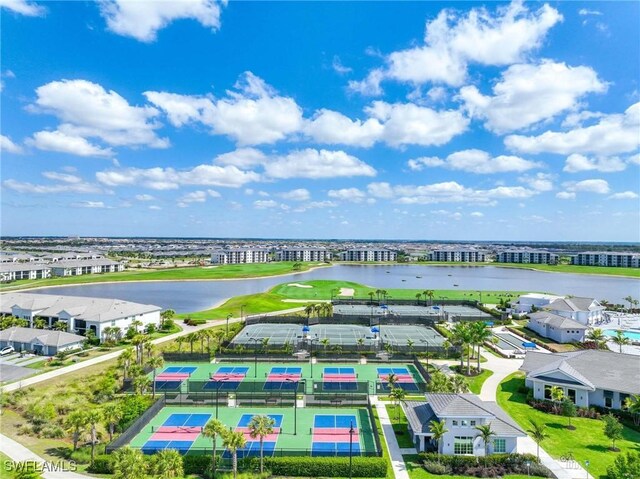 birds eye view of property featuring a water view and view of golf course