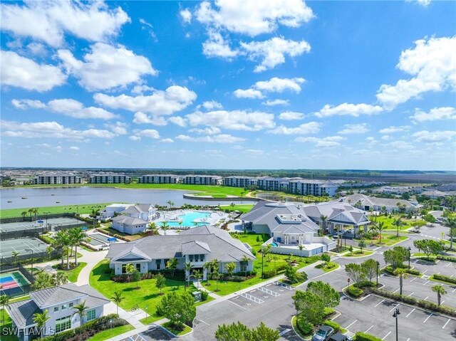 birds eye view of property featuring a water view