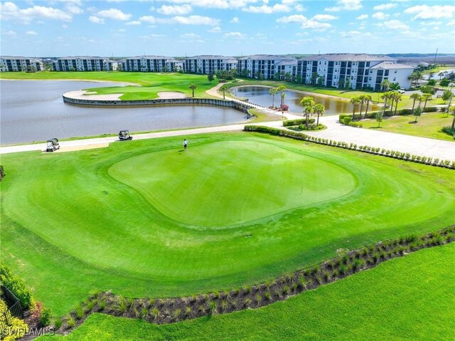 surrounding community featuring a water view and golf course view