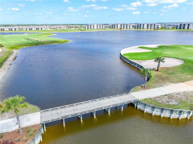 aerial view with a water view and golf course view