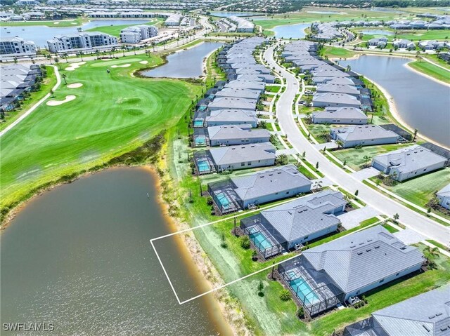 aerial view with a water view, golf course view, and a residential view