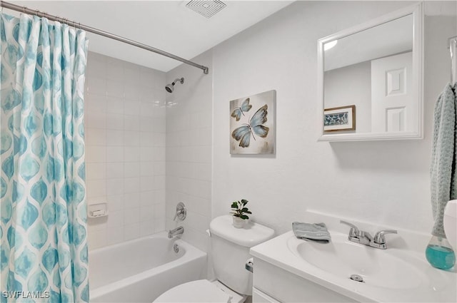 4633 Bayshore Dr Unit M3, Naples, FL 34112 - bathroom with vanity, shower / bath combo with shower curtain, toilet, and visible vents