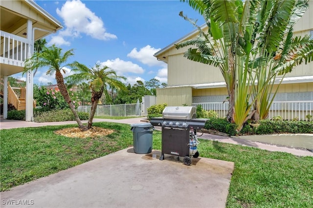 4633 Bayshore Dr Unit M3, Naples, FL 34112 - view of patio featuring stairs, fence, and grilling area
