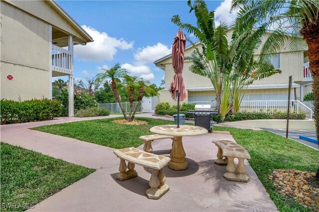 4633 Bayshore Dr Unit M3, Naples, FL 34112 - surrounding community with a patio, fence, and a yard