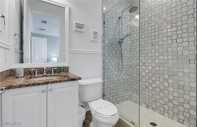 3402 Tigris Ln, Naples, FL 34119 - full bath with visible vents, toilet, a tile shower, and vanity