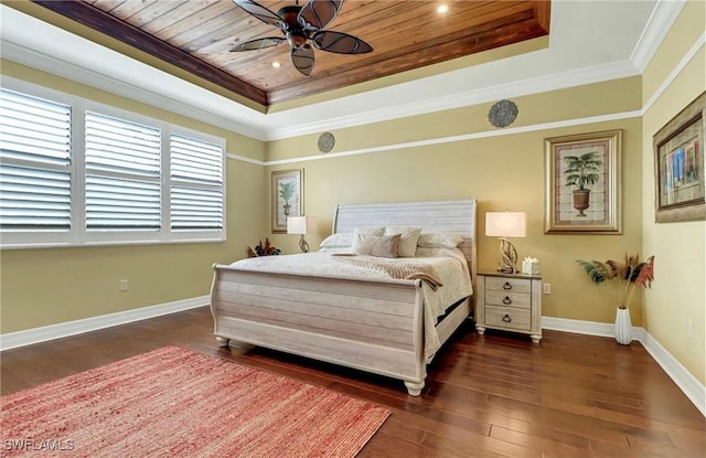 3402 Tigris Ln, Naples, FL 34119 - bedroom featuring dark wood-type flooring, a raised ceiling, and baseboards
