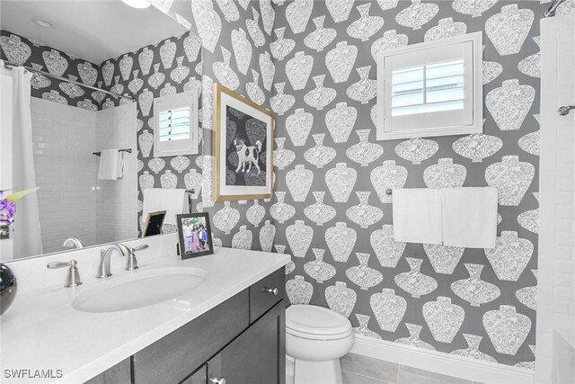 2949 Heritage Pines Dr, Fort Myers, FL 33905 - full bathroom featuring plenty of natural light, wallpapered walls, vanity, toilet, and tiled shower
